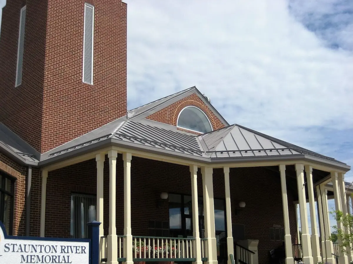 Skilled roofing craftsmen working on a residential roof in Harveysburg